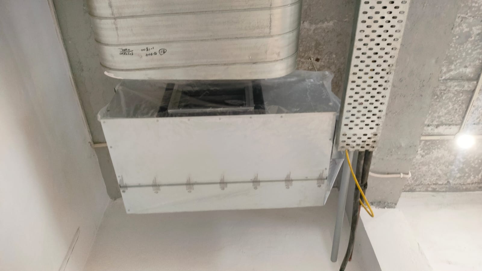 A metal box featuring a fan and ducting, designed for efficient air circulation and ventilation in various settings.